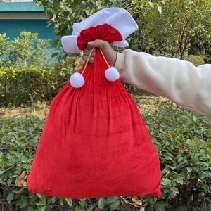 Large red velvet Christmas gift bag with white faux fur trim and gold drawstrings