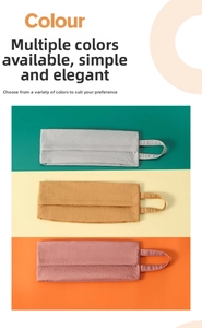 Three travel storage bags in grey, ochre, and rose with durable carry handles