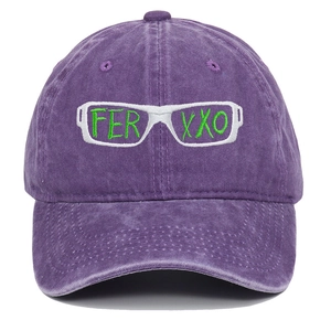 Detailed view of Ferxxo embroidery and green glasses pattern on purple washed baseball cap