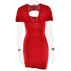 Close-up of deep V-back design with mesh bow detail on a red pleated bodycon dress