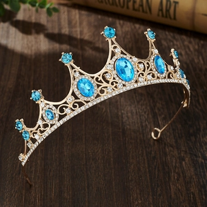 Detail of a vintage golden tiara with blue gemstones and rhinestones for girls