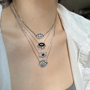 Elegant S925 sterling silver necklaces featuring four diverse blue evil eye pendant designs