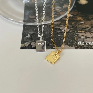 Close-up of gold and silver S925 sterling silver geometric square pendant necklaces