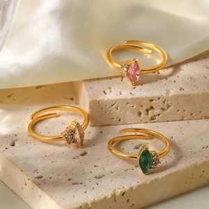 Set of three gold-plated titanium steel rings featuring pink, clear, and green zircon stones