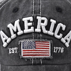 Detail of 3D America embroidery and vintage USA flag patch on washed cotton baseball cap