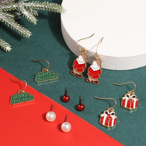 Detailed set of Christmas earrings featuring Santa, gift boxes, and festive motifs