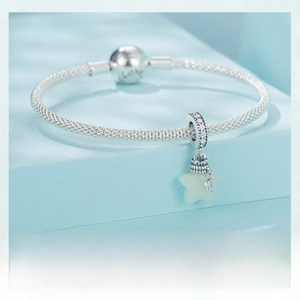 Close-up of S925 sterling silver mesh bracelet with star pendant and Love engraving