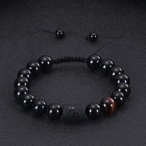 Capricorn zodiac bracelet with black onyx, tiger eye stone, and adjustable braided cord