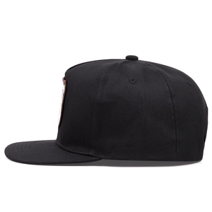 Side view of black hip hop flat brim cap with brown embroidered number 68 patch