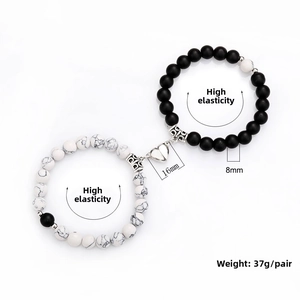 Detail view of 8mm bead bracelets with heart-shaped magnetic clasp and 37g pair weight