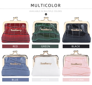 Detail view of glossy crocodile pattern coin purses in six colors with metal clasps