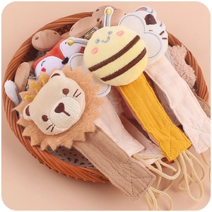 Handmade beech wood and crochet animal pacifier clips with lion and bee designs