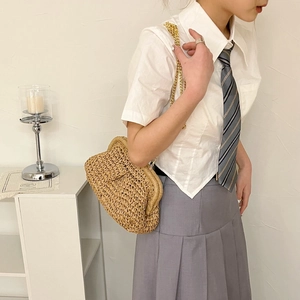 Straw woven crossbody bag with golden chain strap and metallic clasp for women