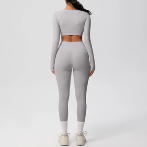 Back view of high-elasticity matte yoga set with long sleeve crop top and high waist leggings