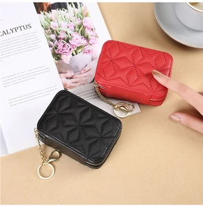 Quilted leather mini makeup bags in red and black with zipper and metal keychain