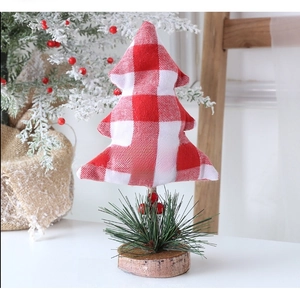 Detailed view of mini red and white plaid fabric Christmas tree on wood base