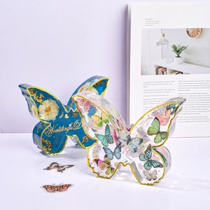 Large butterfly resin bookend with dried flowers and gold lettering for home decor