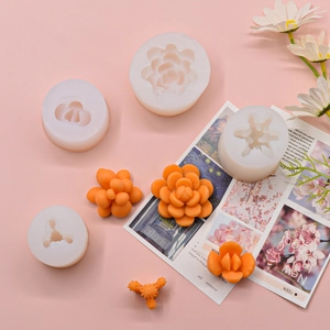 DIY silicone molds for succulent candles and resin crafts on a pink floral background