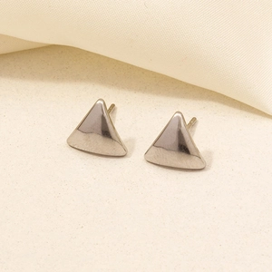 Detailed macro view of minimalist polished 304 stainless steel triangle stud earring