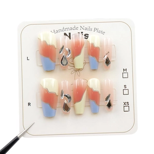 French salt blue press-on nails with mixed color patterns and sparkling silver rhinestones
