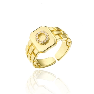 Detail view of adjustable 18K gold plated ring with paved cubic zirconia and link texture