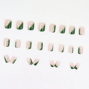 Modern gradient press-on nails with pink and dark green marbling and gold line accents