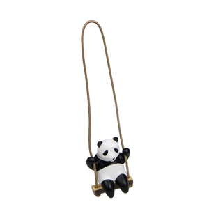 Detail of creative panda swinging ornament with resin texture and wood base detail