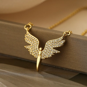 Gold angel wing pendant necklace with pavé zircon crystals on a delicate chain