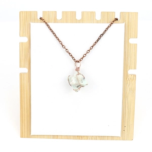 Handmade copper wire wrapped natural stone hexagon pendant necklace on wooden stand