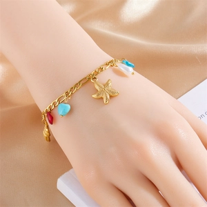 Gold stainless steel bracelet featuring starfish, heart and pearl charms on champagne silk