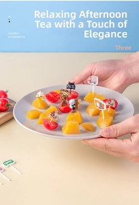 Close-up of cute cartoon animal and vehicle fruit picks for kids bento and snacks