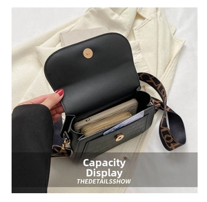 Detail view of the black stone pattern crossbody bag showing internal storage space