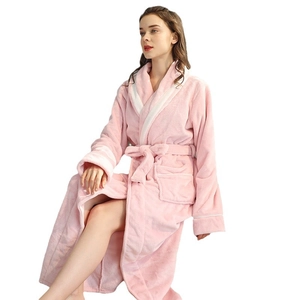 Plush pink flannel long bathrobe with white contrast lapel and cuffs for winter lounging
