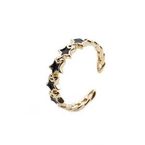 Adjustable minimalist star ring in gold finish with black star inlay for women