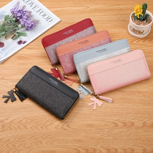 Long zip wallet for women in multiple colors with tassel and glitter patchwork design