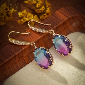 Elegant gold drop earrings featuring oval gradient blue purple gemstones and zircons