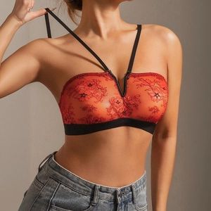 Close-up of red lace tube top bra with delicate floral embroidery and adjustable straps