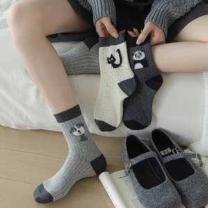 Three-pack cotton crew socks with cute flocked animal patterns like cats and pandas