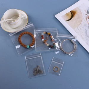 Transparent PVC self-sealing jewelry bags in various sizes for earrings and necklaces