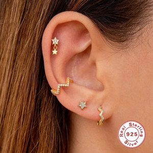 S925 sterling silver gold wave hoop earrings set with sparkling zircon on a female ear