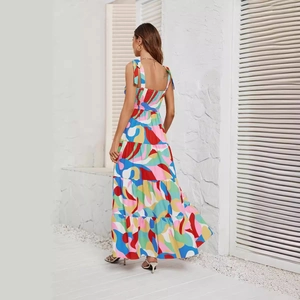 Colorful abstract print maxi sundress for women with a backless tie-up design and tiered skirt