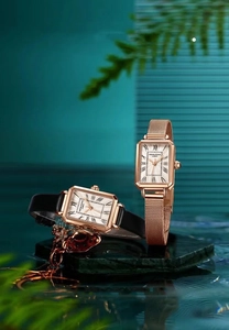 Elegant rose gold square women's watch with Roman numerals and rose gold mesh band.