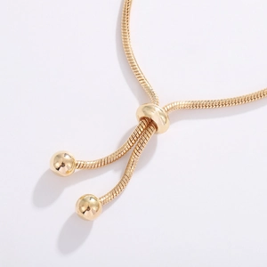 Adjustable golden copper snake chain bracelet with slide clasp and small round beads