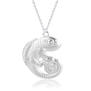 Macro detail of lizard shaped stainless steel pendant necklace with realistic scale textures