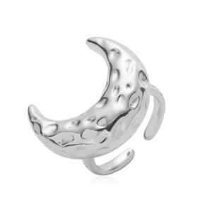 Macro detail of the silver moon ring showcasing the unique hammered texture finish