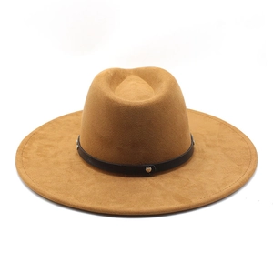 Detail of camel suede wide brim fedora hat featuring black rivet band and fiber texture