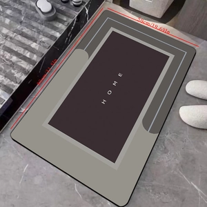 Close-up of 80x50cm modern diatom mud bath mat with HOME text on marble floor