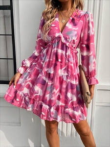 Detail view of the pink floral V-neck dress featuring layered ruffles and flared cuffs