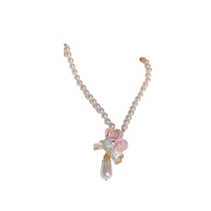 Sweet pink ceramic rose necklace with faux pearls and butterfly pendant charm
