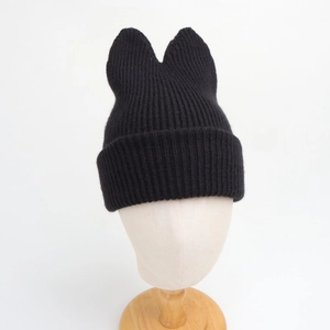 Detailed view of black ribbed knit winter hat with 3D cat ear design for kids